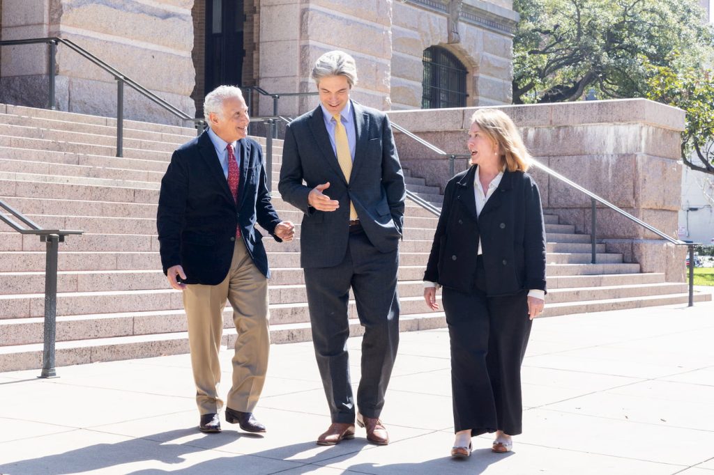 Professional Colleagues Walking and Conversing Outside a Government Building
